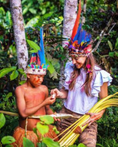 Vanesa, Miss Progress International 2019, with a young Yagua guy in the Colombian Amazon